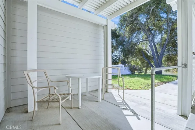a view of a patio with a yard