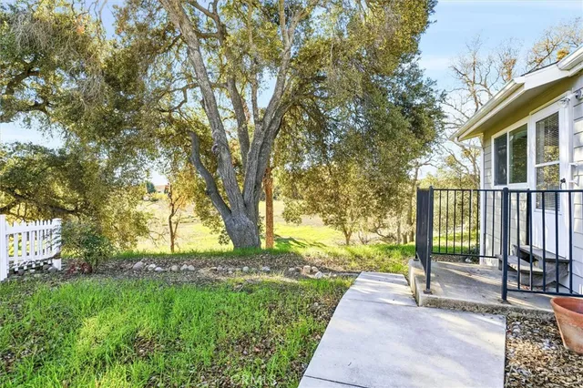 a view of a garage with furniture and a ceiling fan