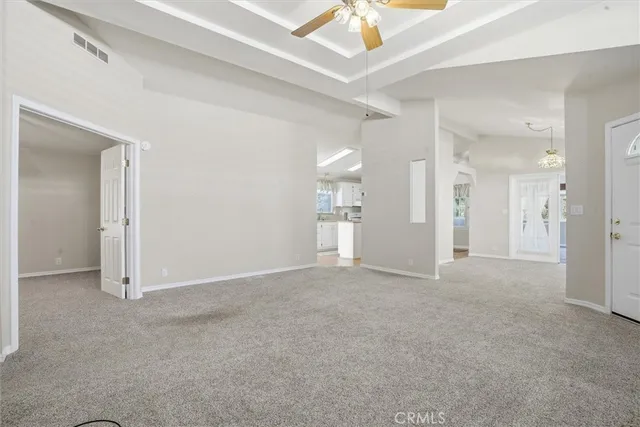 an empty room with a bathroom and a shower