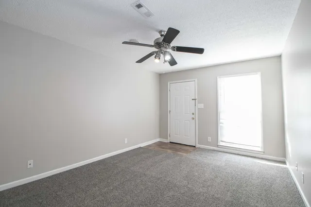 a view of a ceiling fan in a room