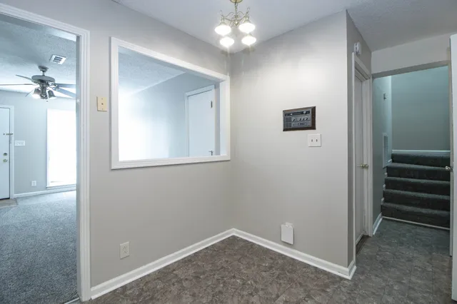 wooden floor in an empty room with a mirror
