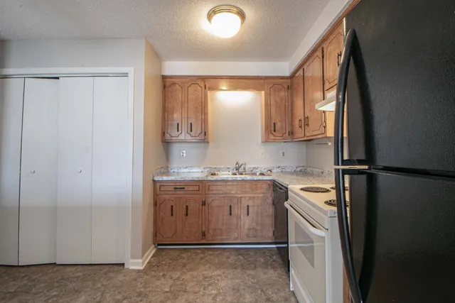 a kitchen with a sink and cabinets