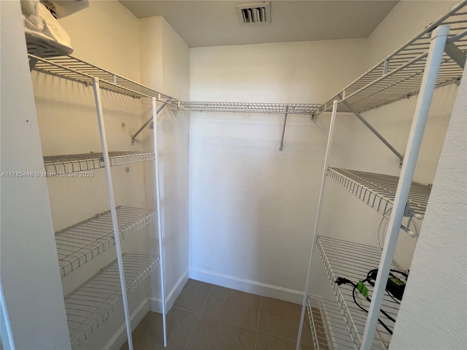 1830 Radius Drive, Unit 909 Hollywood, FL 33020 - Photo 11 of 22 a bathroom with a glass shower door