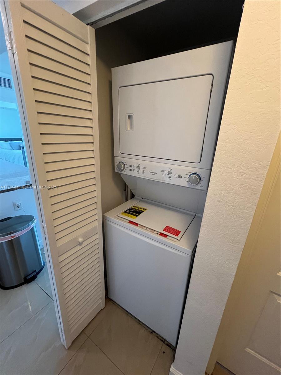 1830 Radius Drive, Unit 909 Hollywood, FL 33020 - Photo 17 of 22 a utility room with dryer and washer