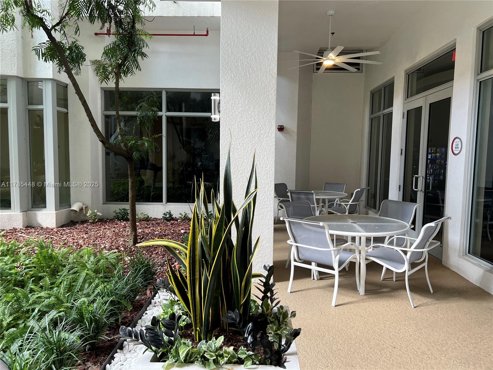 1830 Radius Drive, Unit 909 Hollywood, FL 33020 - Photo 21 of 22 a view of a house with backyard and porch