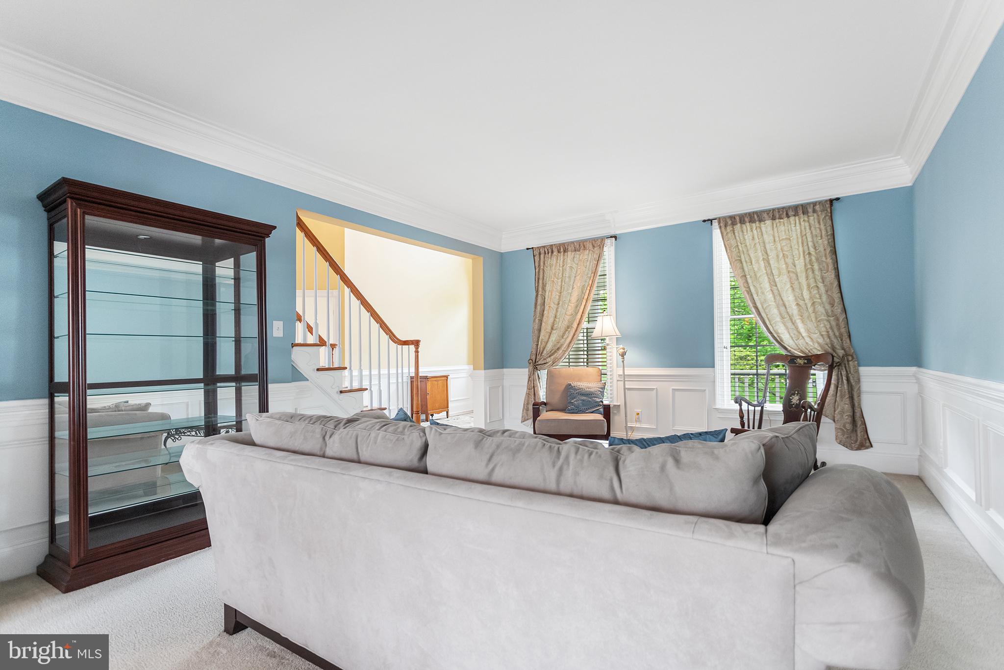 103 Sloan Road West Chester, PA 19382 - Photo 11 of 56 a living room with couches and a large window with outer view