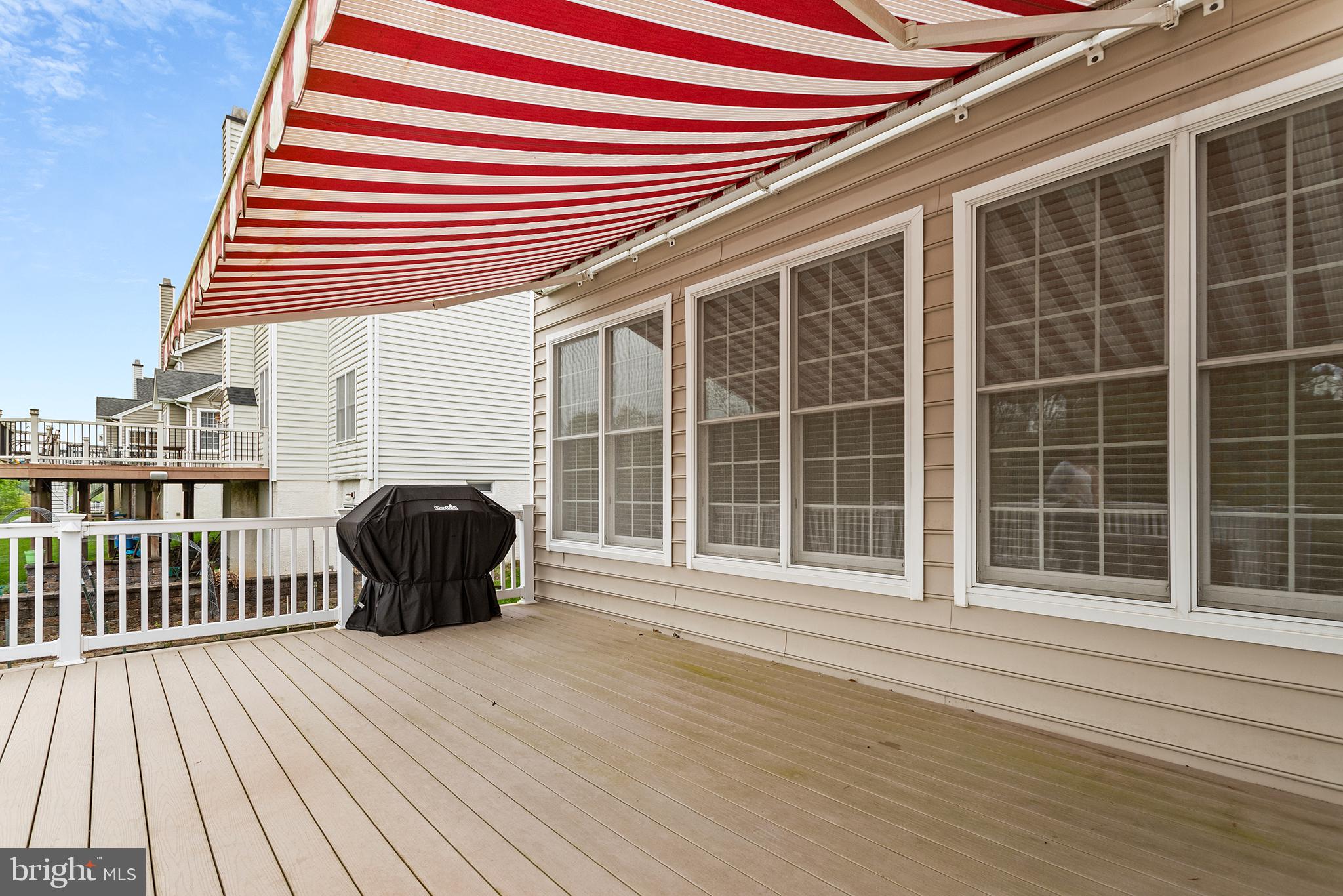 103 Sloan Road West Chester, PA 19382 - Photo 21 of 56 a view of a roof deck with wooden floor and fence