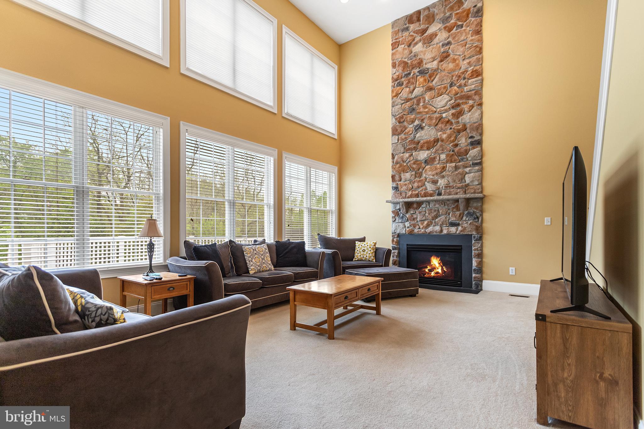 103 Sloan Road West Chester, PA 19382 - Photo 22 of 56 a living room with furniture and a fireplace