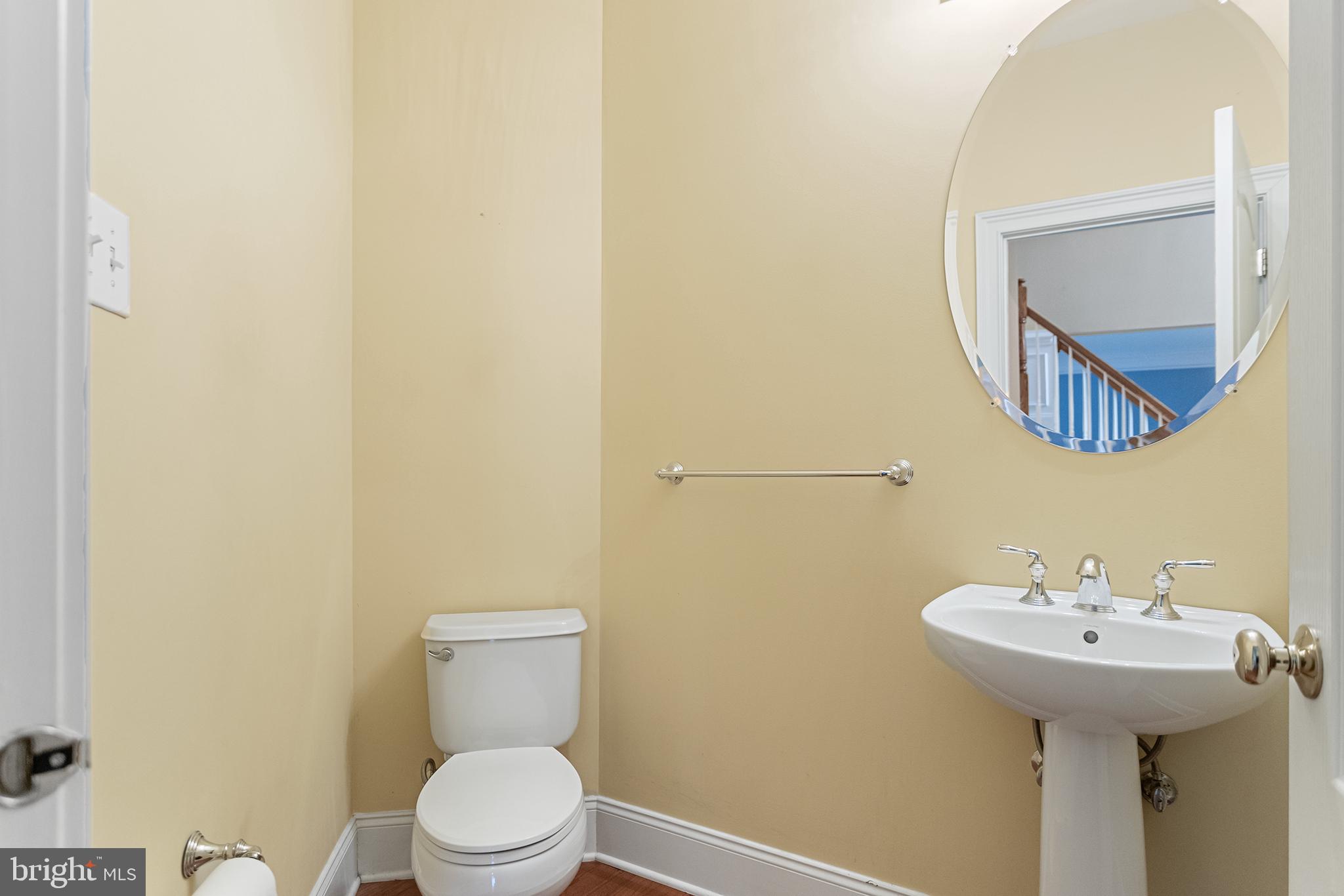 103 Sloan Road West Chester, PA 19382 - Photo 28 of 56 a bathroom with a toilet sink and mirror