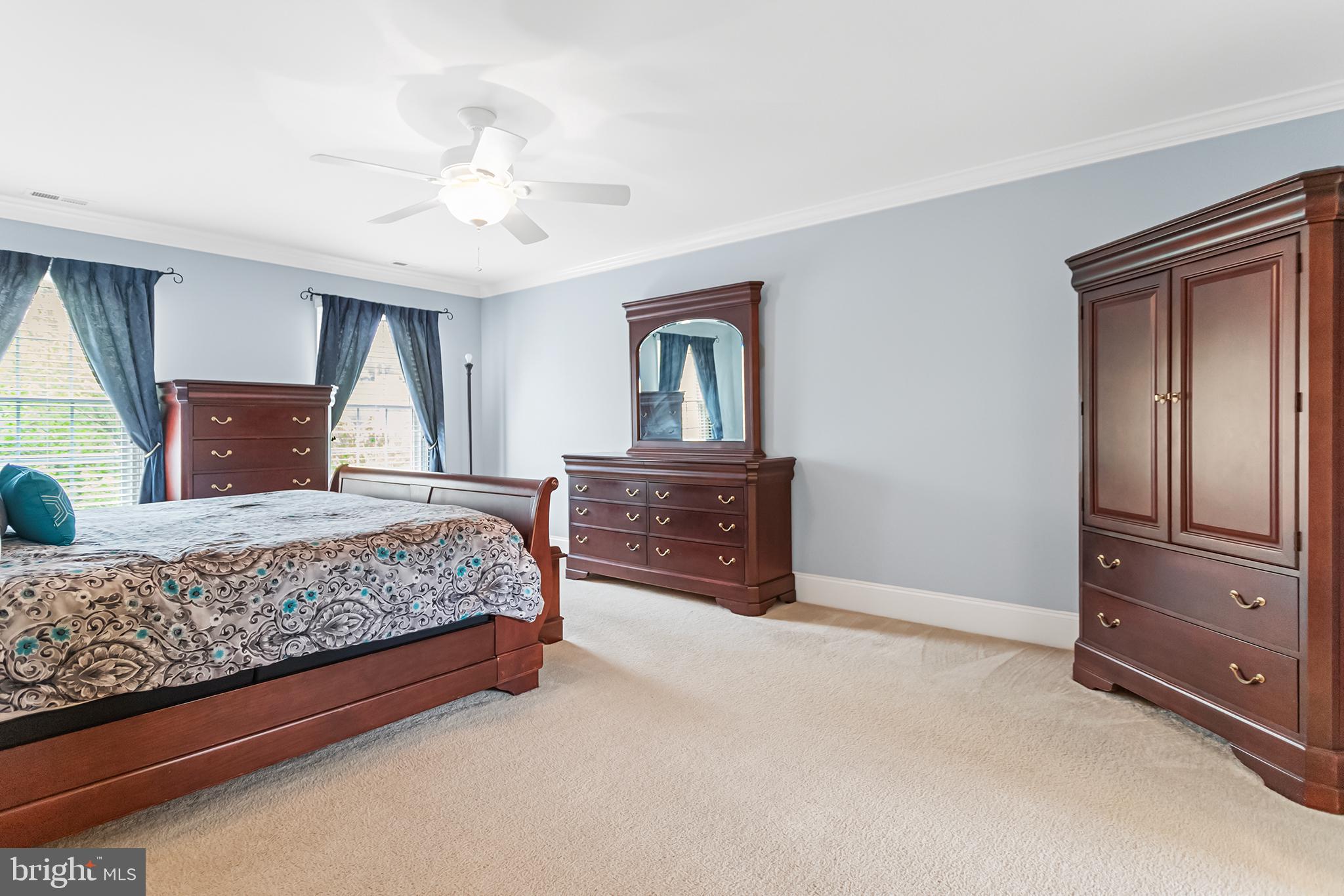 103 Sloan Road West Chester, PA 19382 - Photo 29 of 56 a bedroom with a large bed and dresser