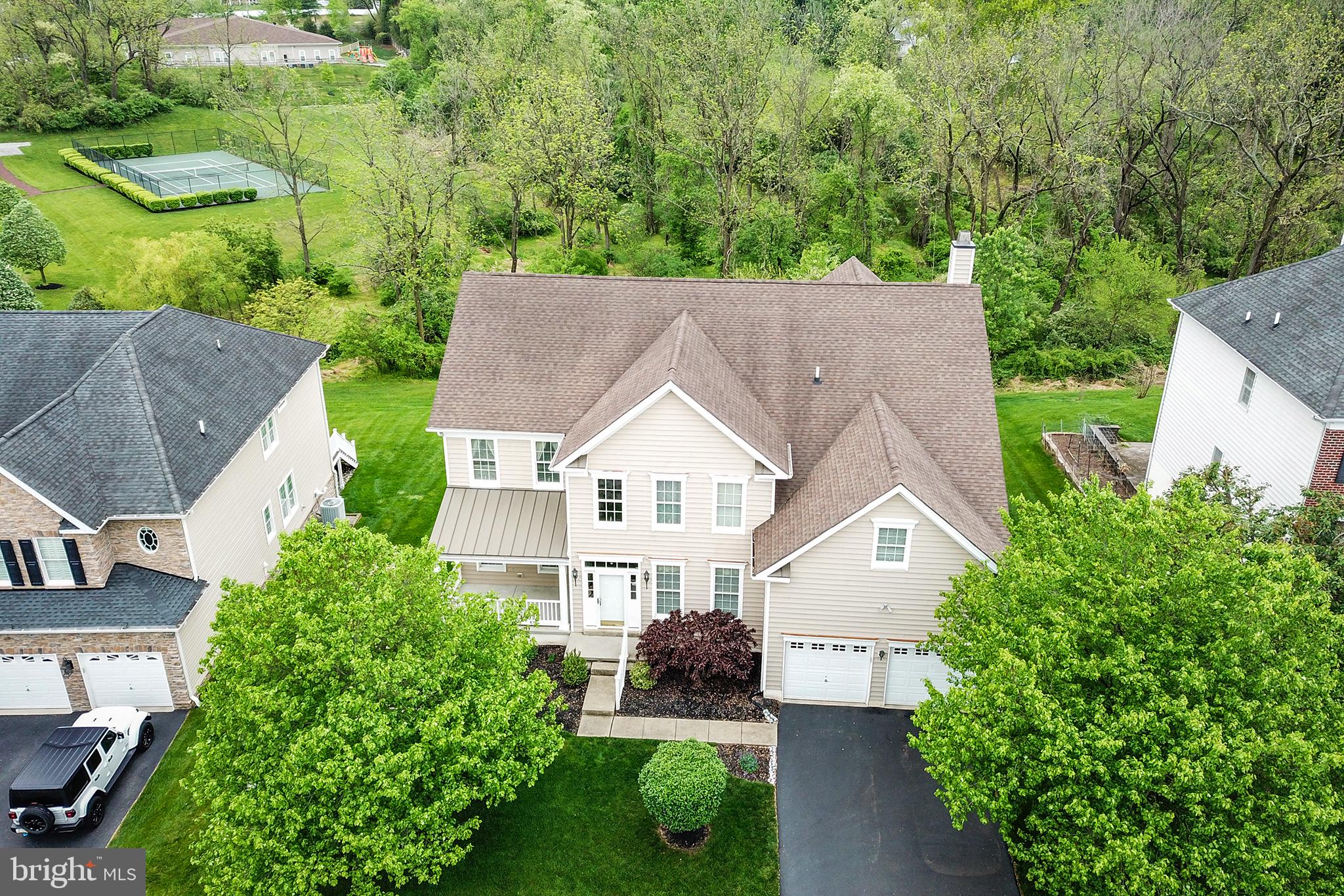 103 Sloan Road West Chester, PA 19382 - Photo 3 of 56 an aerial view of a house with yard and trees in the background