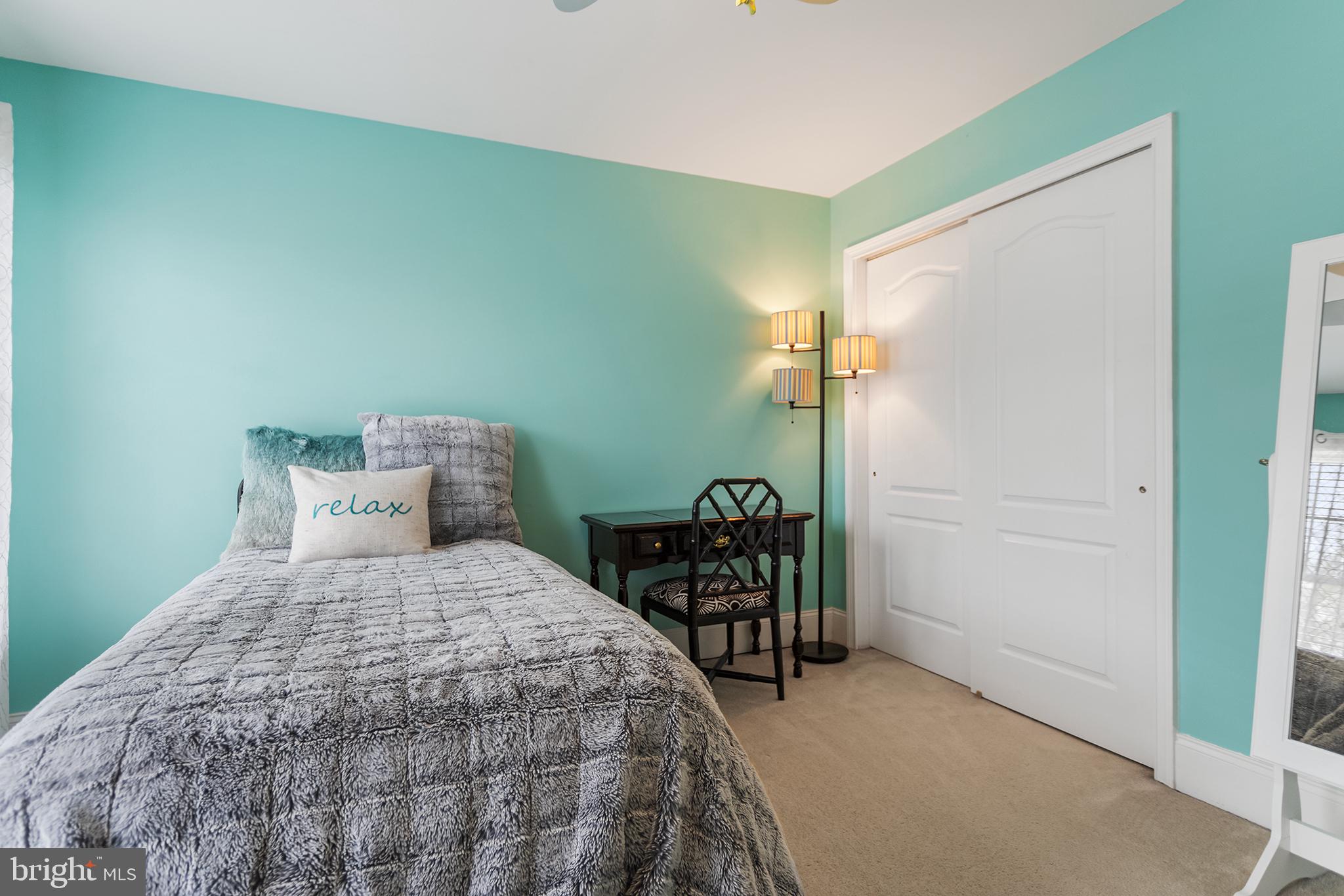 103 Sloan Road West Chester, PA 19382 - Photo 37 of 56 a bedroom with a bed and a table in it