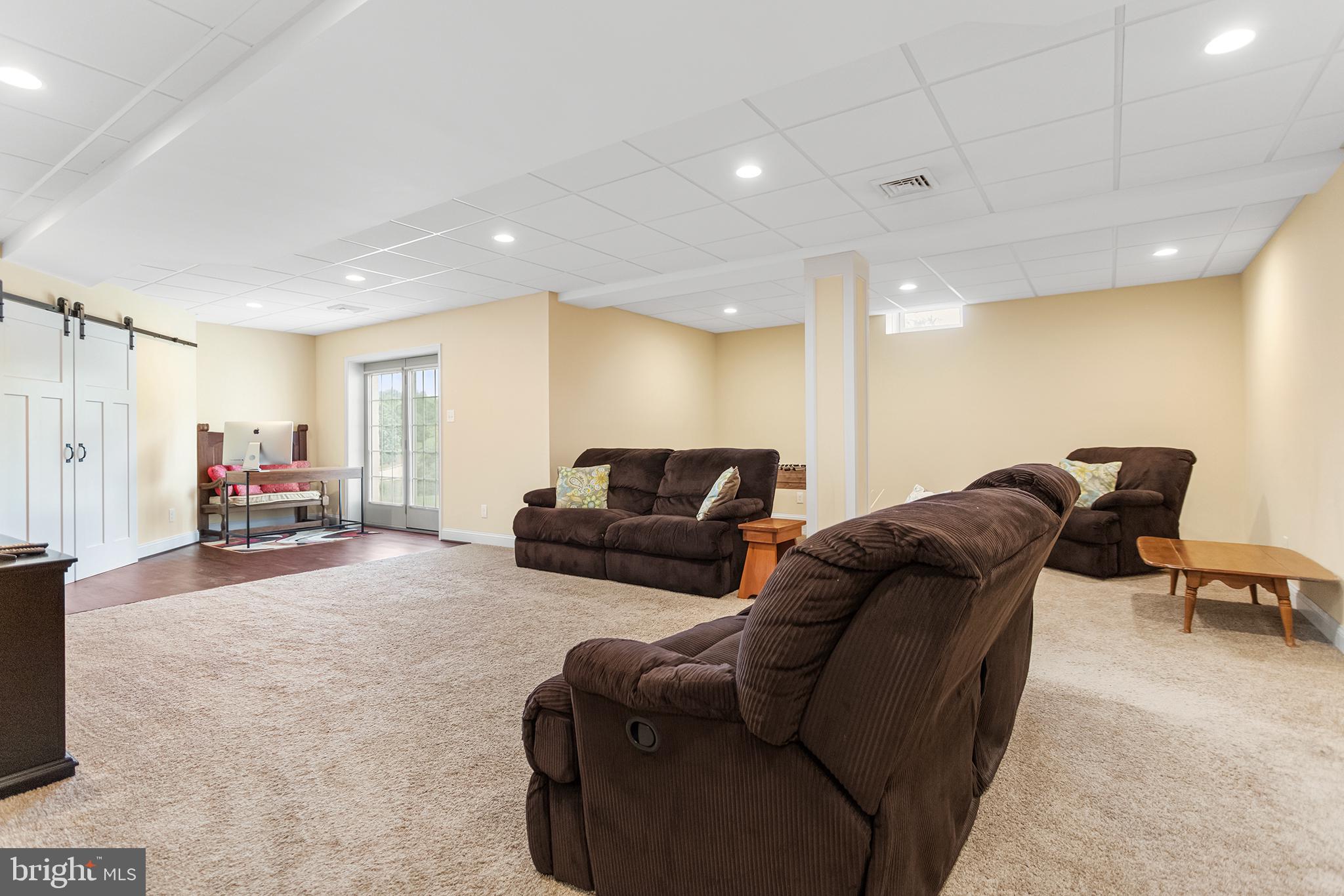 103 Sloan Road West Chester, PA 19382 - Photo 44 of 56 a living room with furniture and a flat screen tv