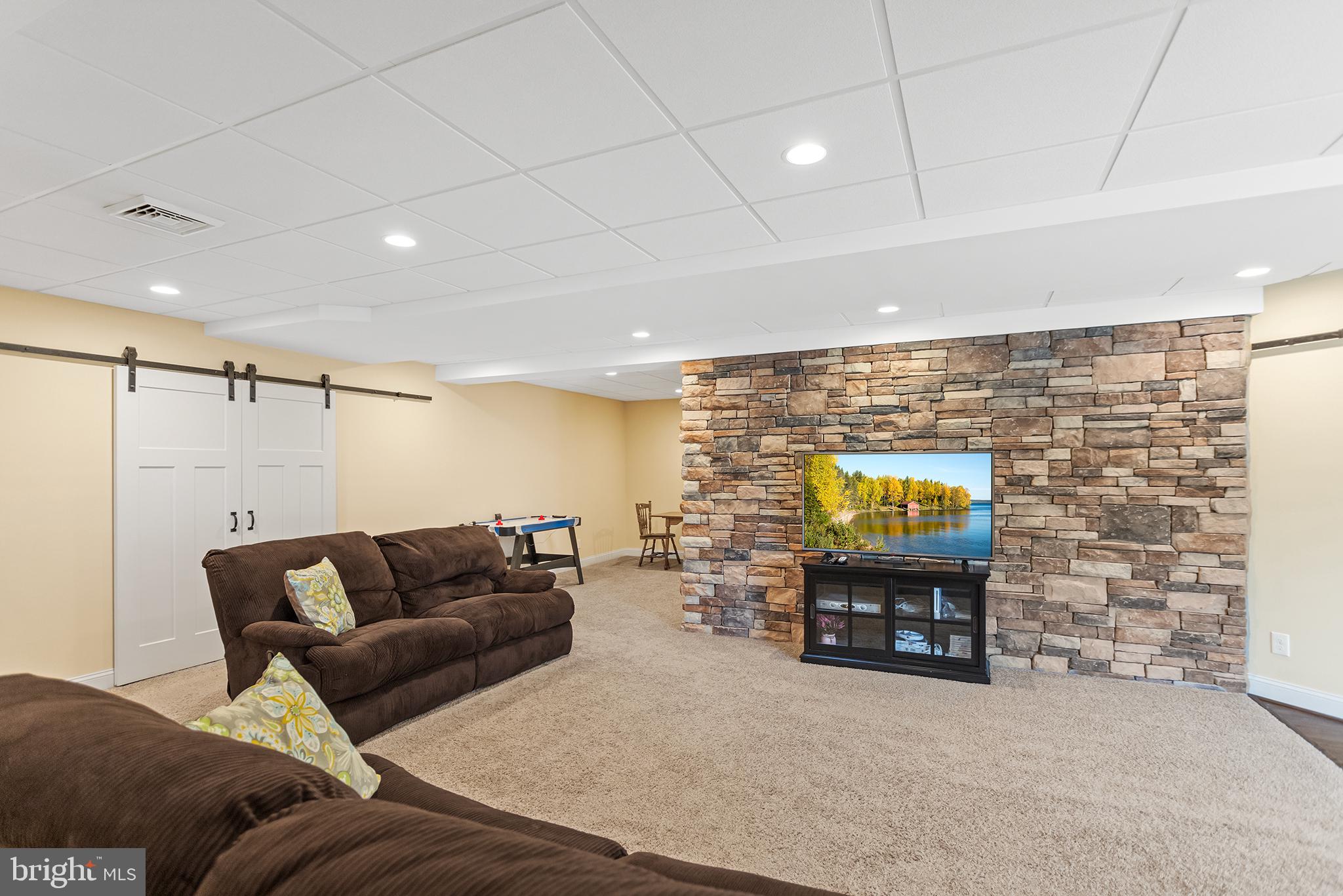 103 Sloan Road West Chester, PA 19382 - Photo 45 of 56 a living room with furniture and a fireplace
