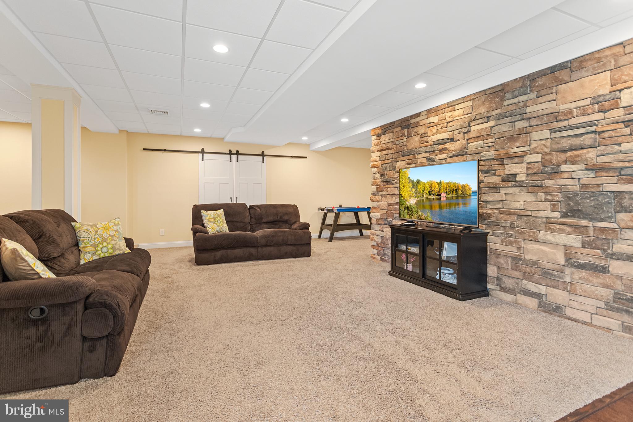 103 Sloan Road West Chester, PA 19382 - Photo 46 of 56 a living room with furniture and a flat screen tv
