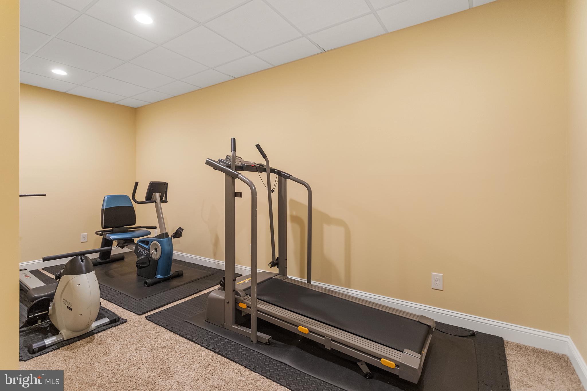 103 Sloan Road West Chester, PA 19382 - Photo 47 of 56 a room with gym equipment and view of living room