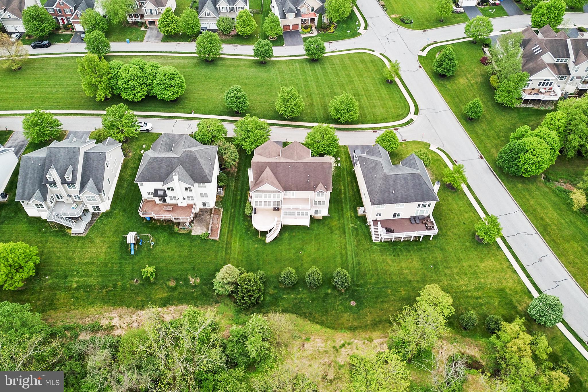 103 Sloan Road West Chester, PA 19382 - Photo 50 of 56 an aerial view of a house with a garden and lake view