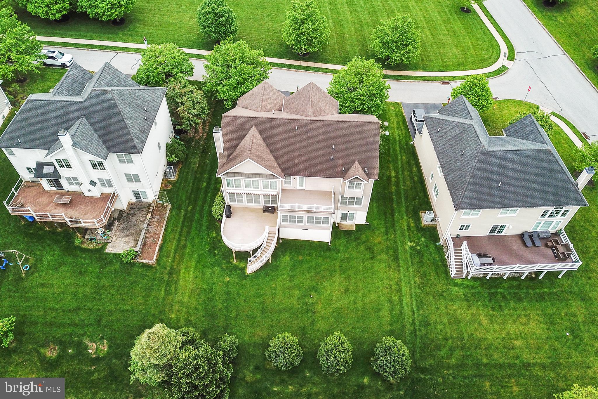 103 Sloan Road West Chester, PA 19382 - Photo 52 of 56 an aerial view of a house with a garden and trees