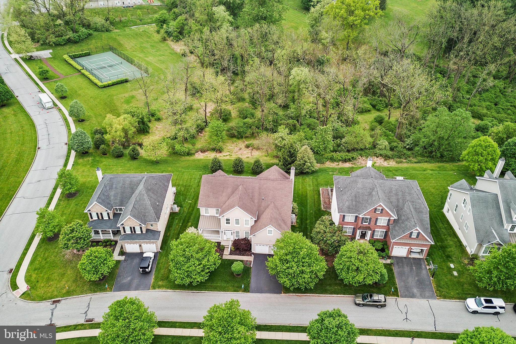 103 Sloan Road West Chester, PA 19382 - Photo 53 of 56 an aerial view of a house with garden space and a street view
