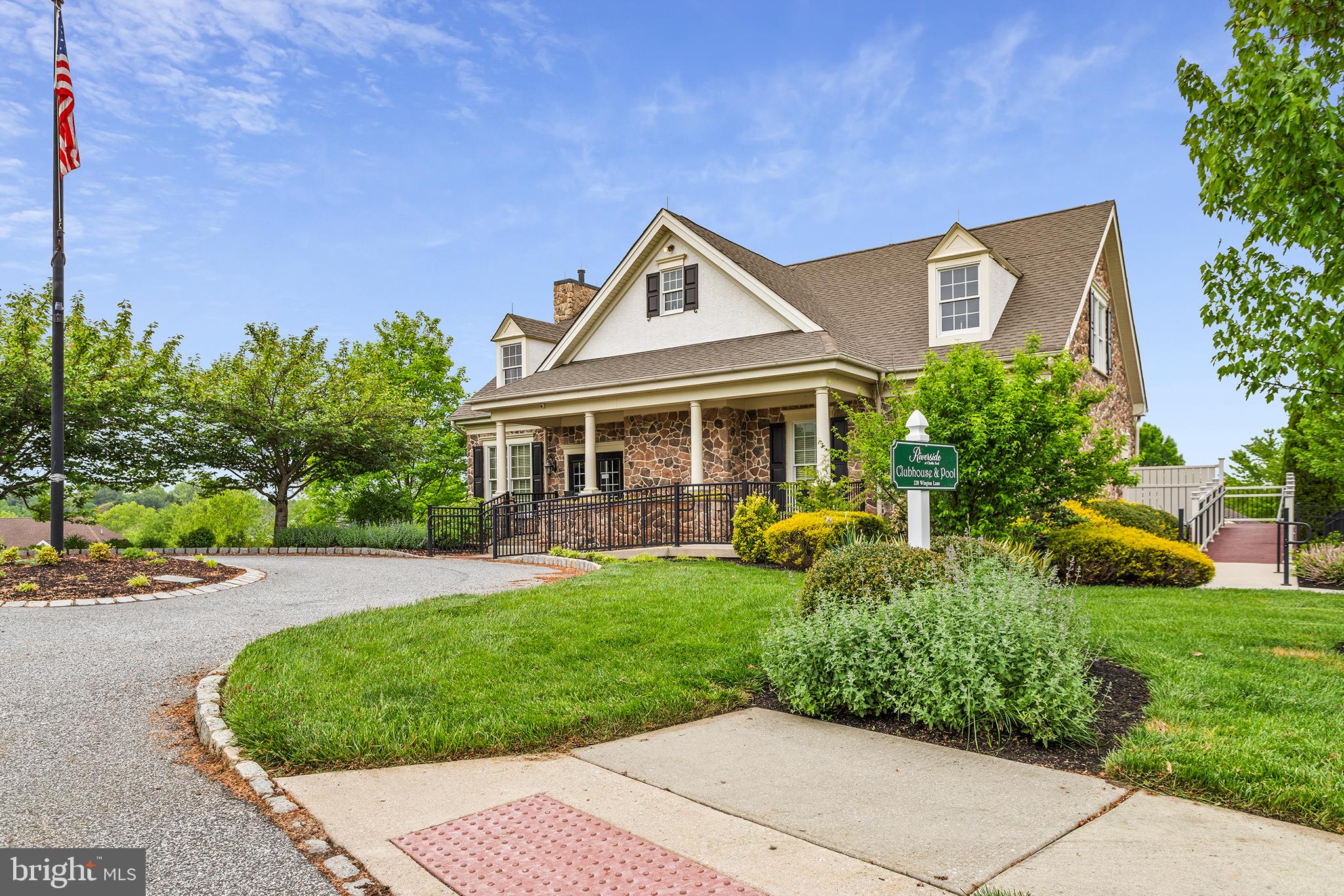 103 Sloan Road West Chester, PA 19382 - Photo 55 of 56 a front view of a house with a yard and trees