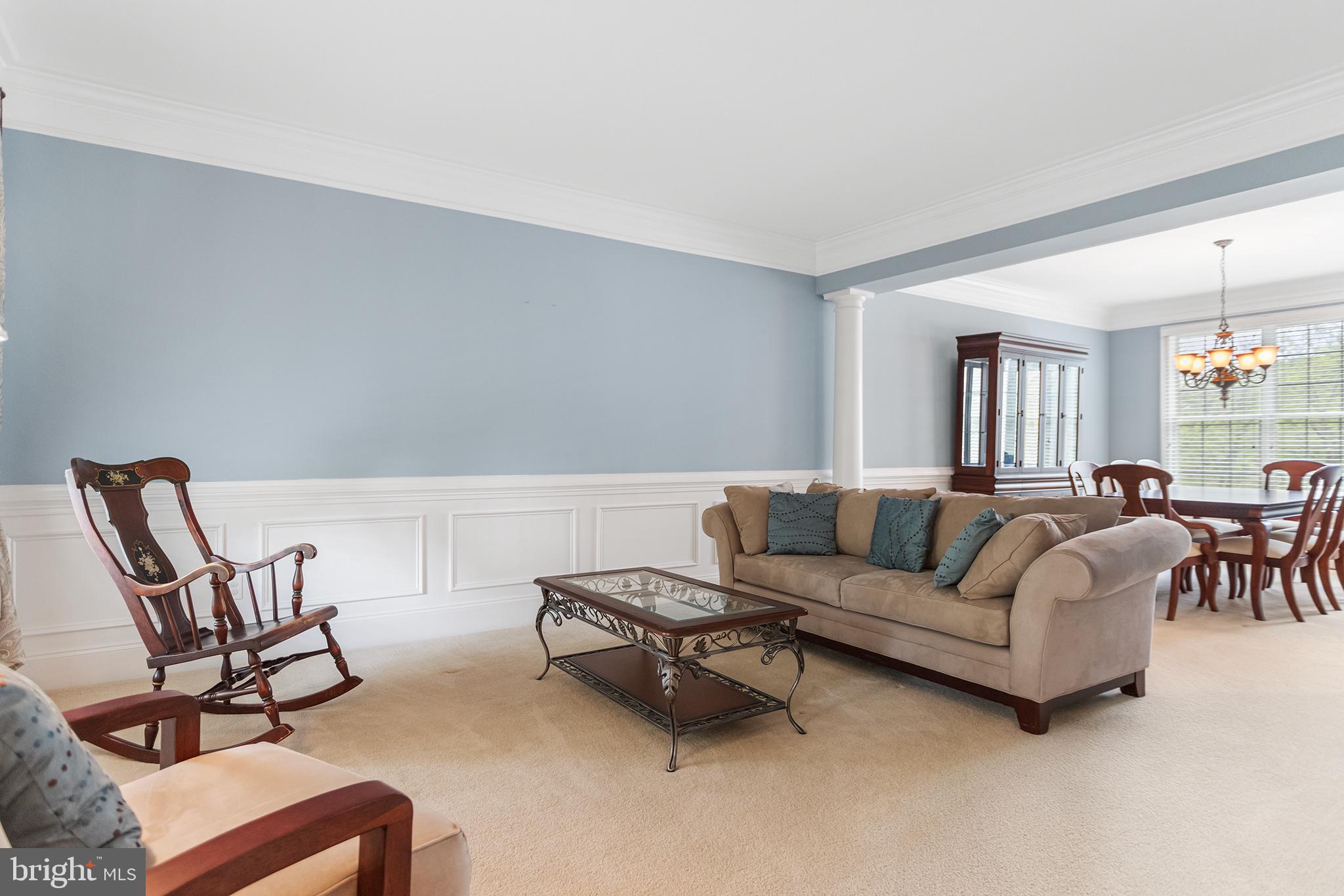 103 Sloan Road West Chester, PA 19382 - Photo 10 of 56 a living room with furniture and a dining table with chair