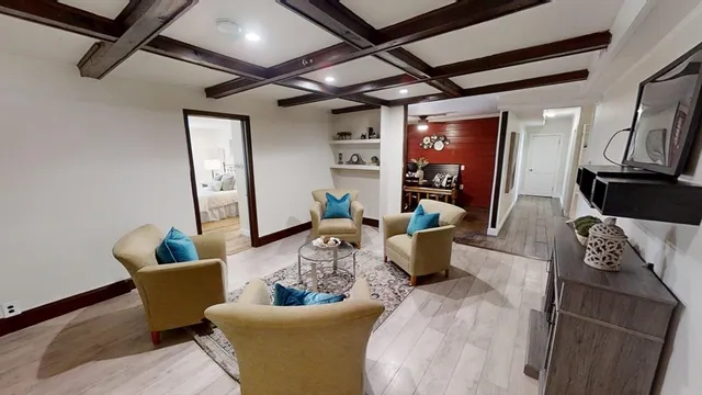 a living room with furniture and a window