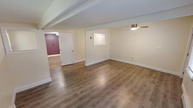 a bedroom with a bed and a tv