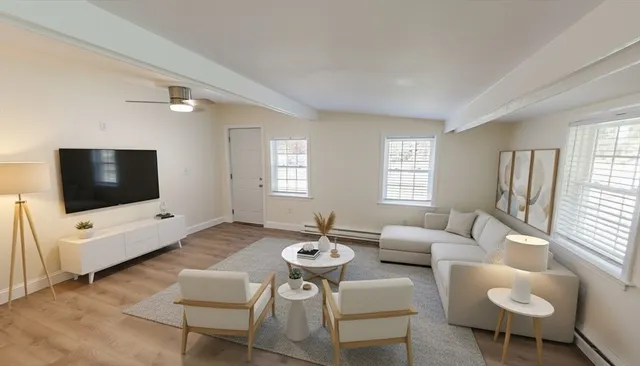 a bedroom with a bed and a mirror on the dresser