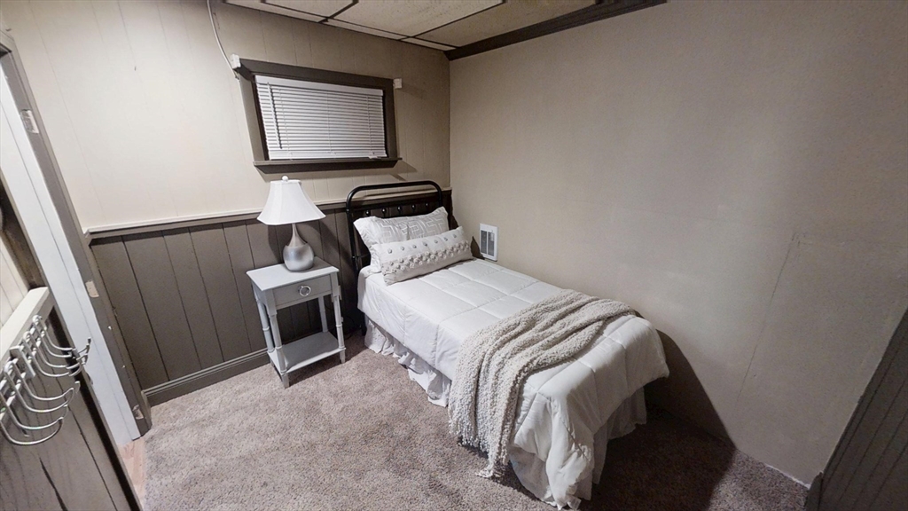 48 Pond Street Salem, NH 03079 - Photo 30 of 35 a bedroom with a bed and a tv