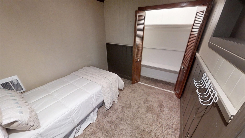 48 Pond Street Salem, NH 03079 - Photo 31 of 35 a bedroom with a bed and a mirror on the dresser