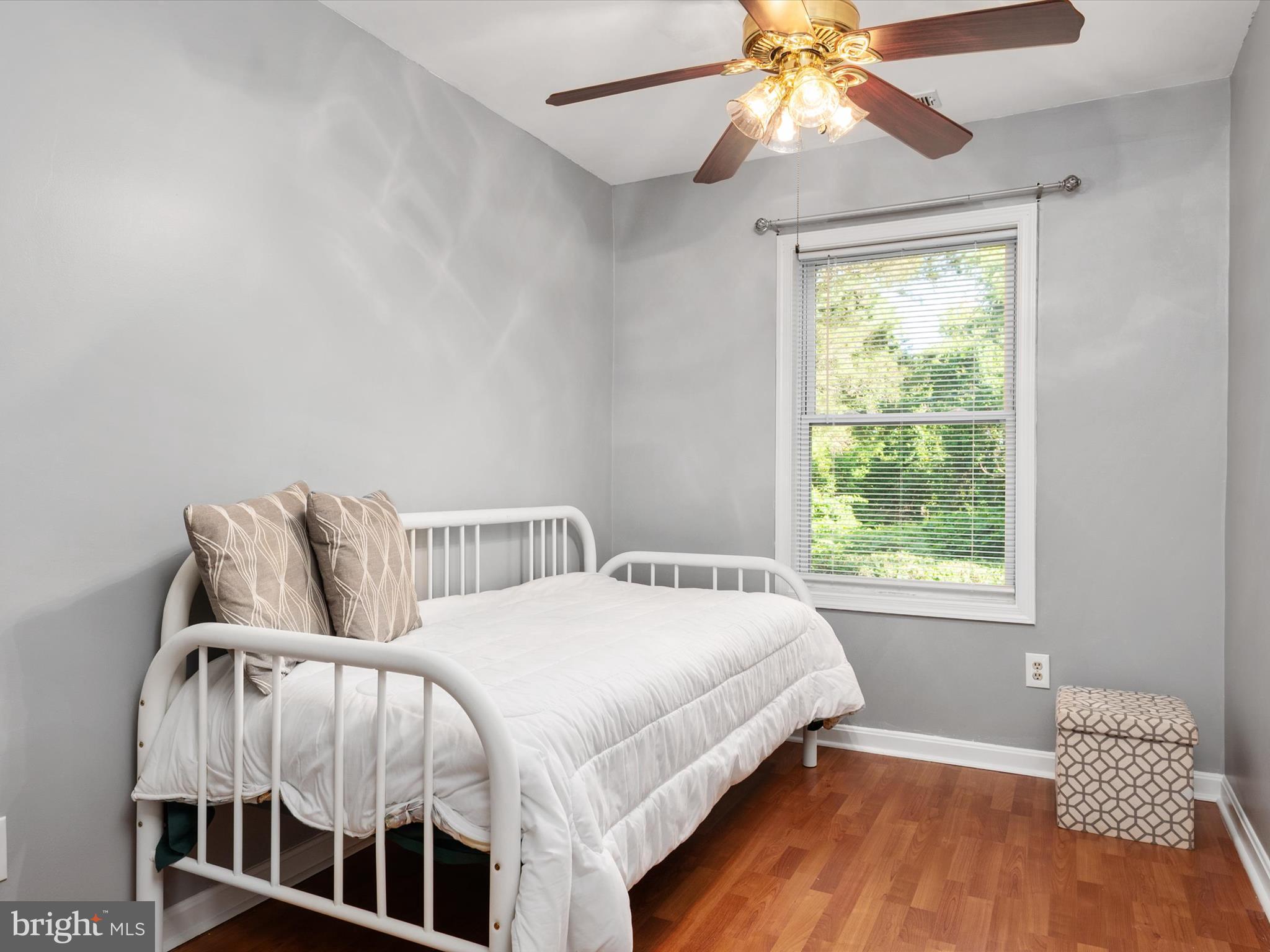 1101 Furnace Road Linthicum Heights, MD 21090 - Photo 30 of 73 a bedroom with a bed and a chandelier