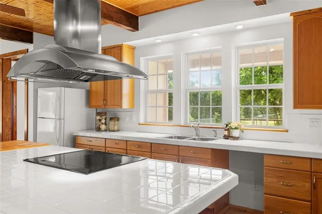 a kitchen with a sink and a window