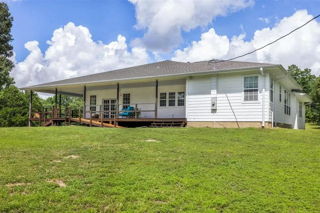 a backyard of a house with lots of green space