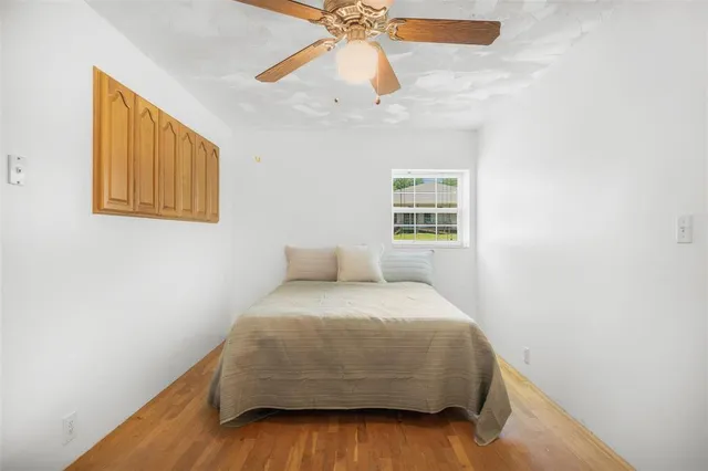a kitchen with granite countertop a refrigerator and a sink