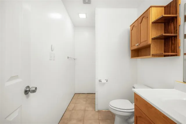 a view of an empty room with storage