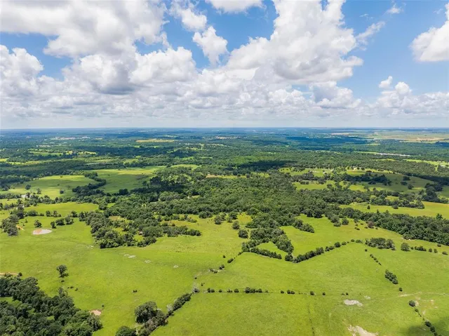 a view of a lake with a big yard