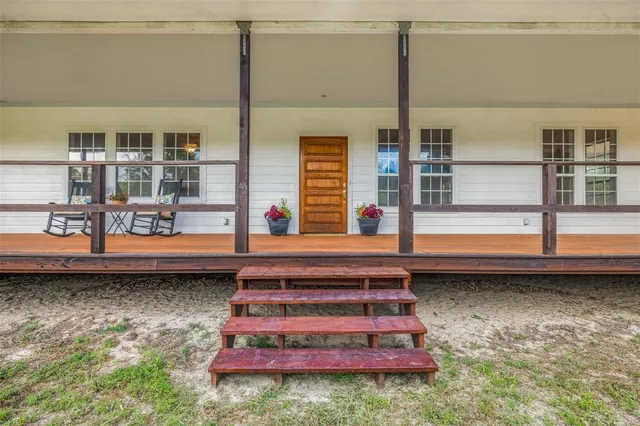a view of pool table and chairs