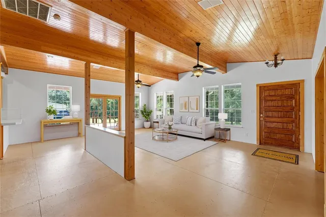 a living room with furniture and a table