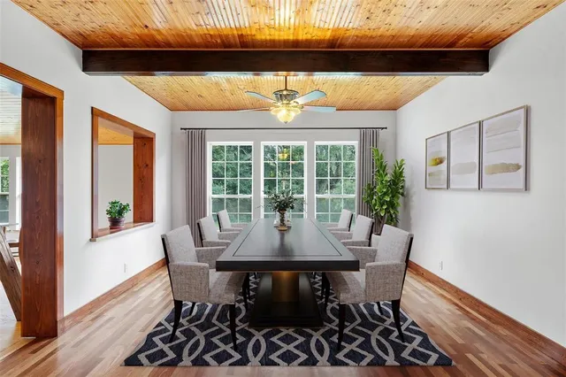 a dining room with furniture and window