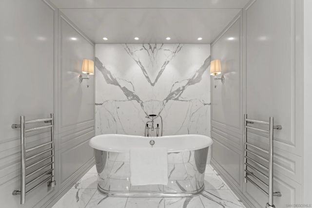 a bathroom with a double vanity sink mirror and shower