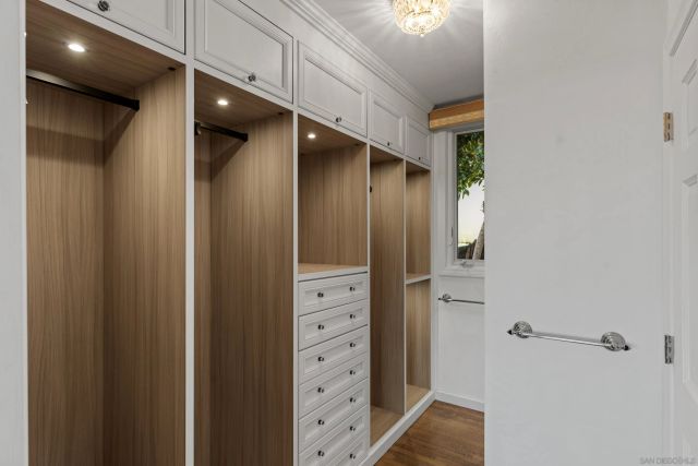 a dining room with furniture and a window