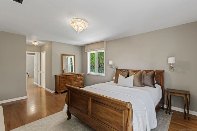 a bathroom with a bathtub shower sink vanity and a toilet