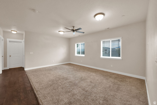 1823 North Crest Road Saratoga Springs, UT 84045 - Photo 5 of 18 Unfurnished room featuring baseboards and ceiling fan