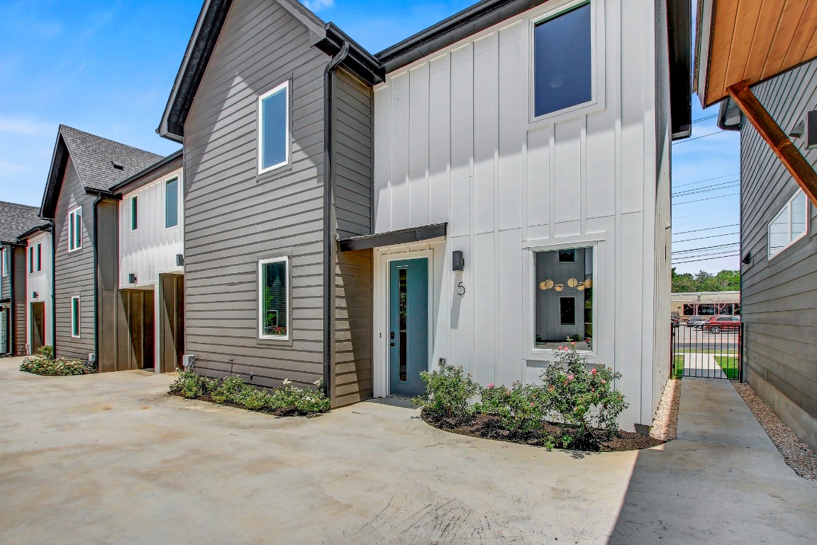 4127 East 12th Street, Unit 5 Austin, TX 78721 - Photo 27 of 33 Multi unit property with board and batten siding and a patio