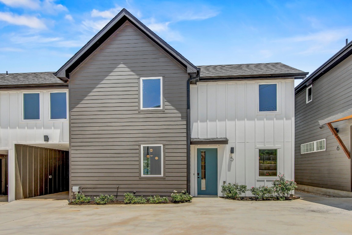 4127 East 12th Street, Unit 5 Austin, TX 78721 - Photo 29 of 33 View of front facade featuring board and batten siding and a shingled roof