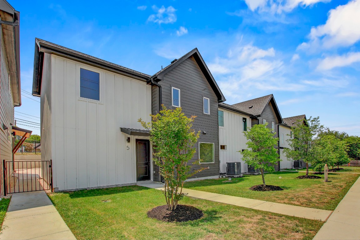 4127 East 12th Street, Unit 5 Austin, TX 78721 - Photo 33 of 33 View of front of property with board and batten siding and central AC unit