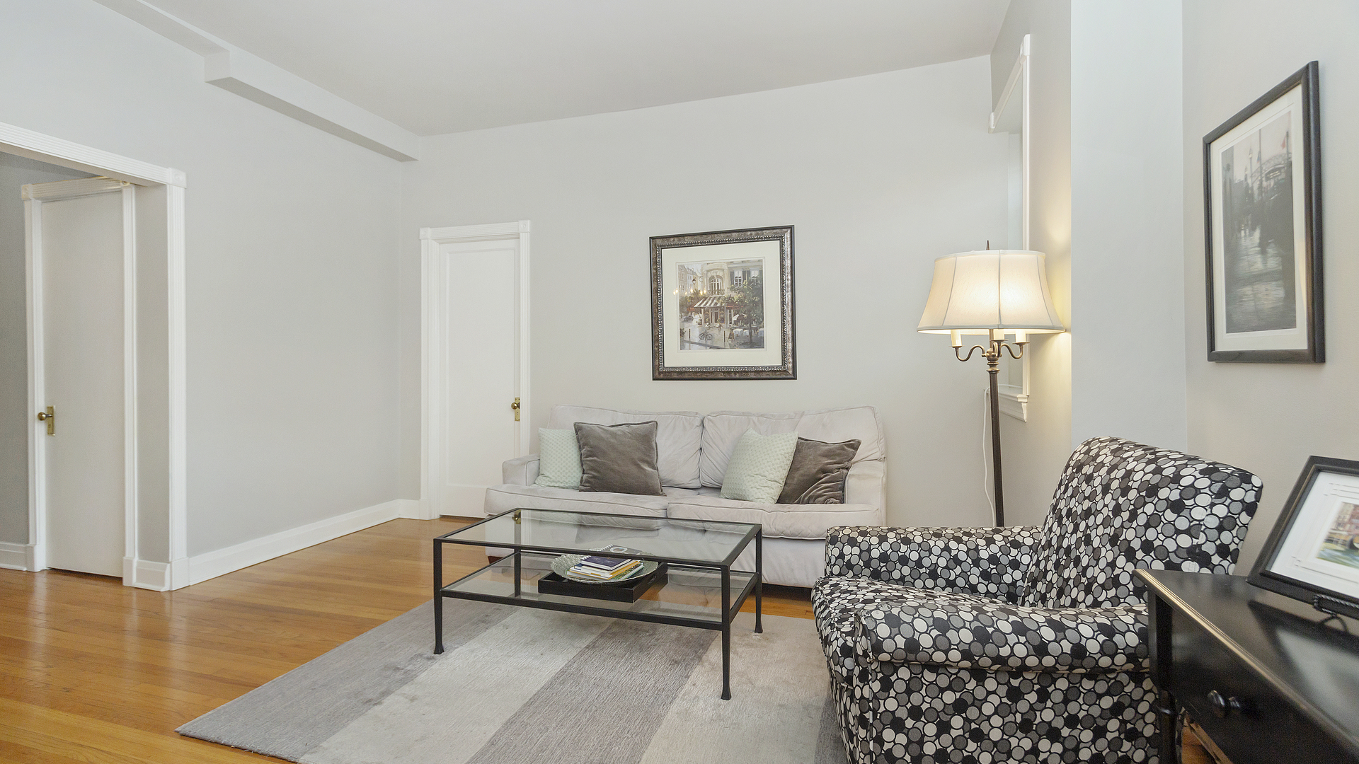 70 East Scott Street, Unit 908 Chicago, IL 60610 - Photo 11 of 15 a living room with furniture and a lamp