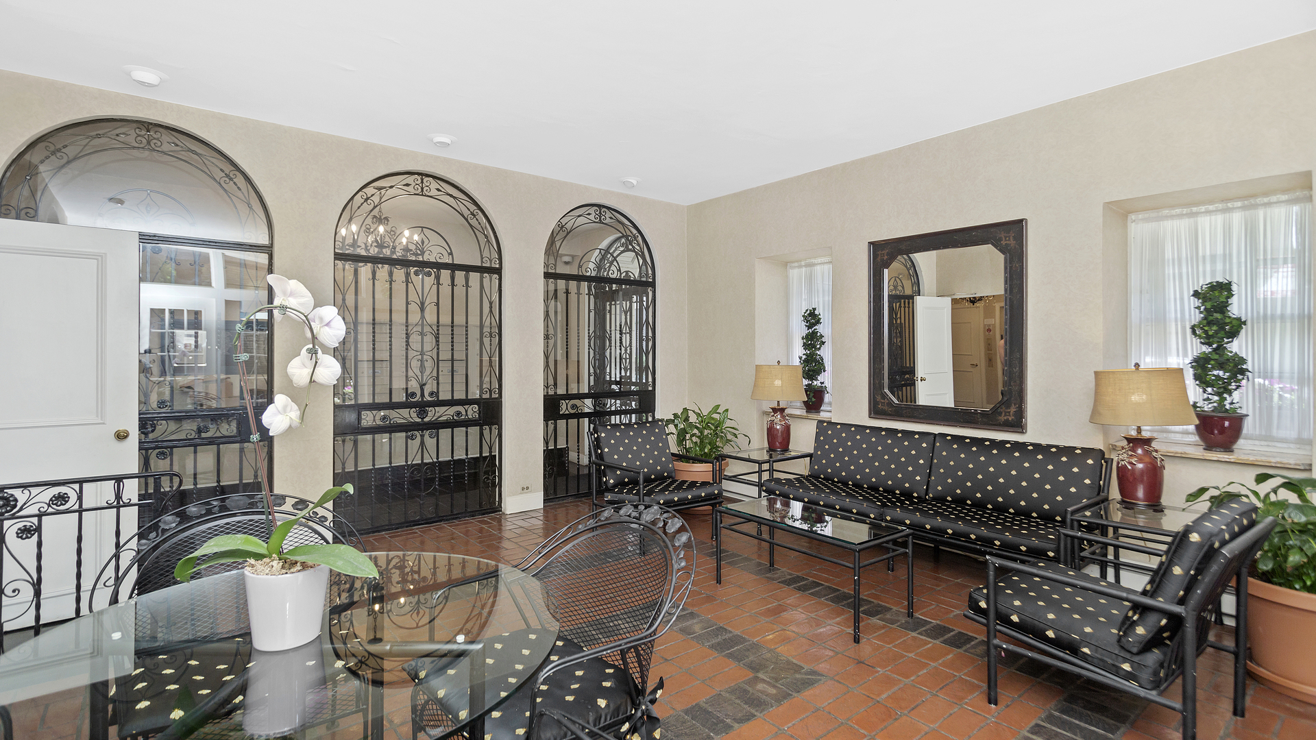 70 East Scott Street, Unit 908 Chicago, IL 60610 - Photo 7 of 15 a living room with furniture a rug and a potted plant