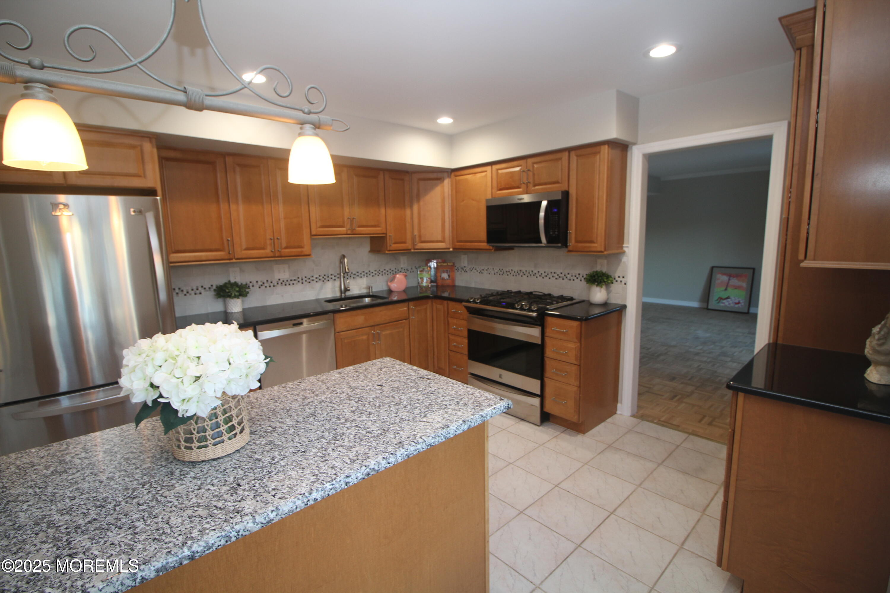 18 Wolfpack Road Trenton, NJ 08619 - Photo 12 of 20 a kitchen with stainless steel appliances granite countertop a sink and a refrigerator