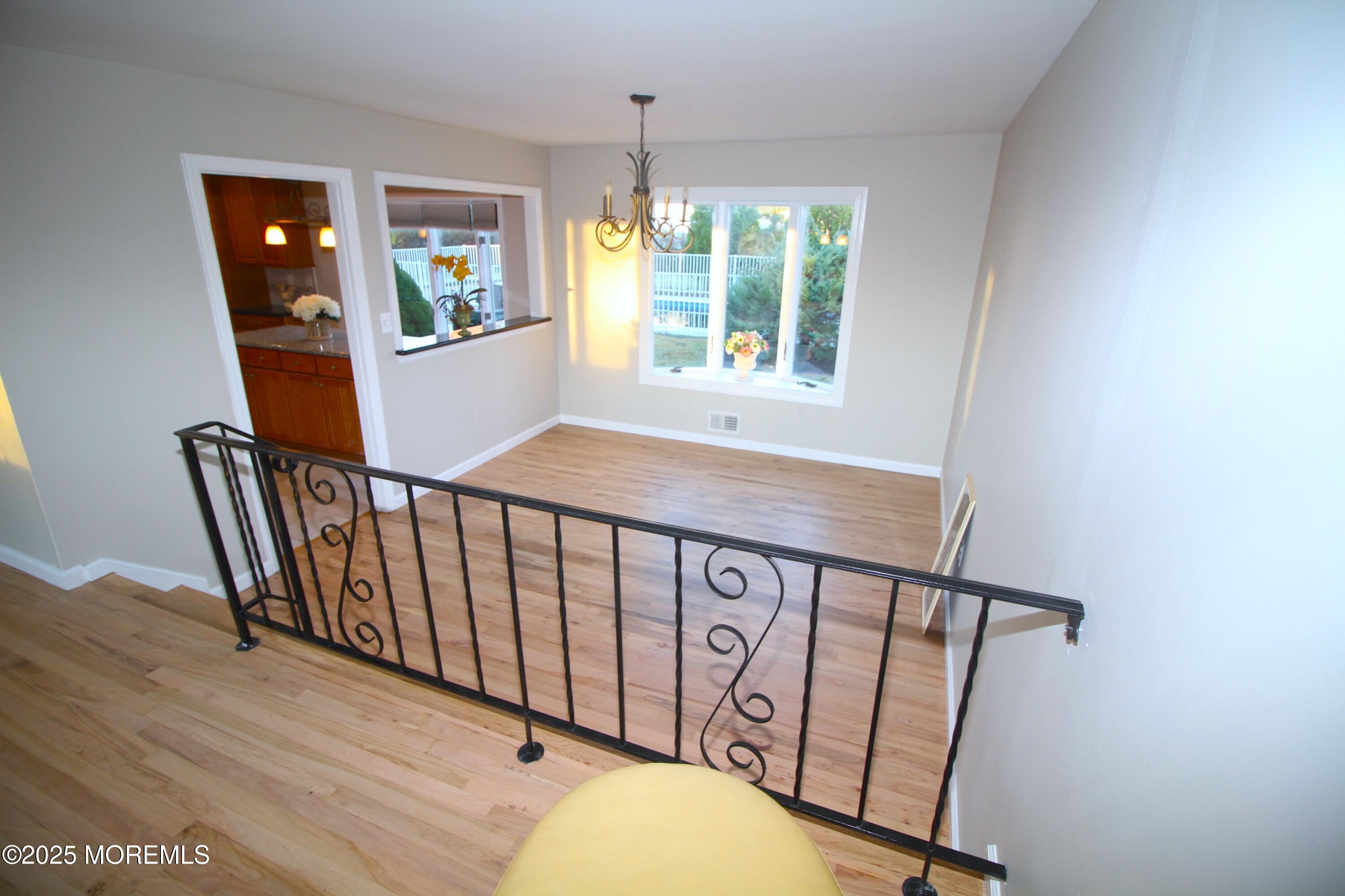 18 Wolfpack Road Trenton, NJ 08619 - Photo 9 of 20 a view of entryway with stairs and wooden floor